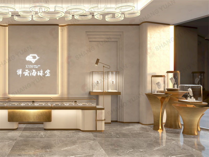 Golden-toned interior view of a modern jewelry shop with flowing display counters and petal-shaped stands